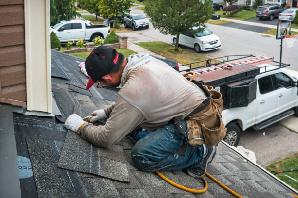 Professional Flat Roof Repair technician working in Camden Point, MO